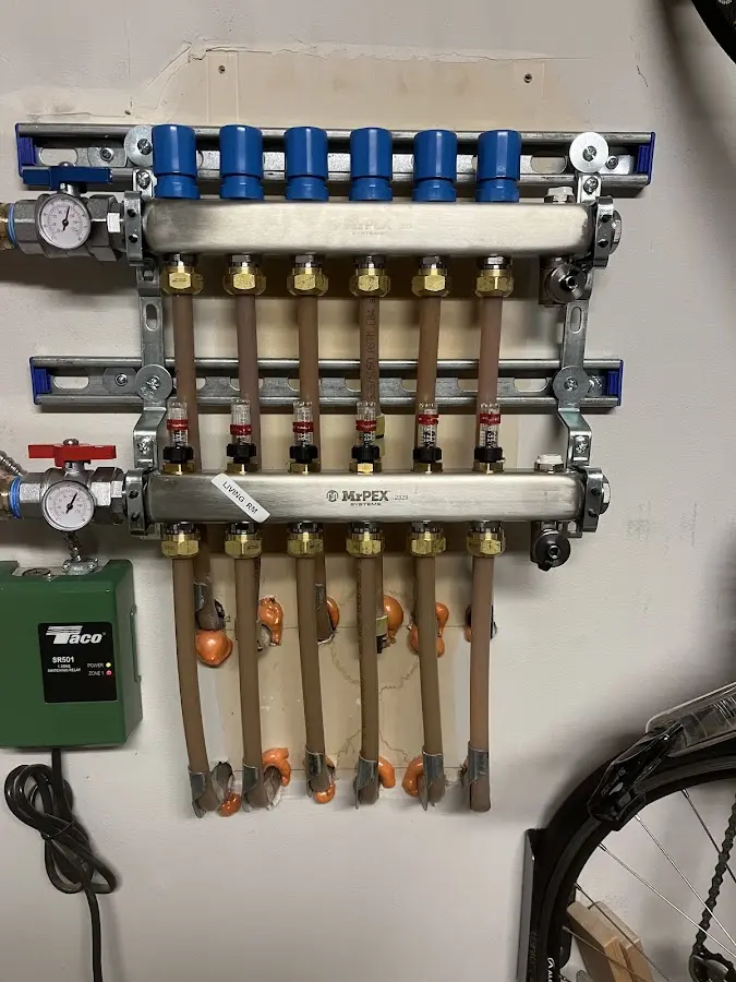 Plumber performing Water Heater Repair at a residential property in Sewanee